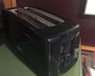 Item #18:  Krups 4-slice toaster (works well but has crack in plastic casing) $5