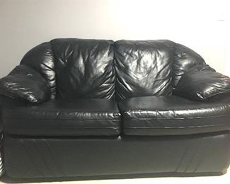Itme #46:  Loveseat (color black)-has small rip on corner of cushion.  63"Lx37"Wx30"H.  $75