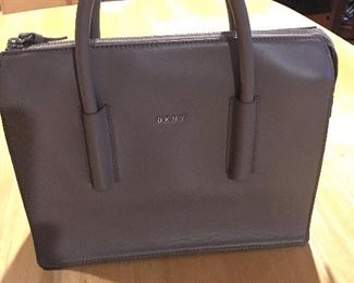 Item #536:  DKNY pocketbook (no shoulder strap). Bag is 9" in height.  $25