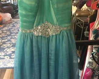 Item 132:  Girl's teal and rhinestone special occasion dress. Size SM.  $15
