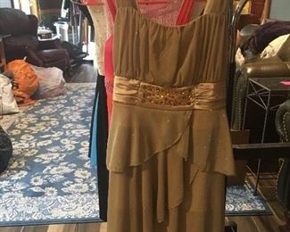 Item #138:  Girl's gold tiered special occasion dress. Size 8. $15