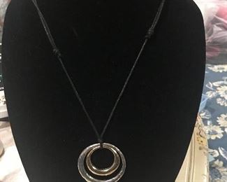 Item #556:  Adjustable robe necklace with pair of metal circles: $6