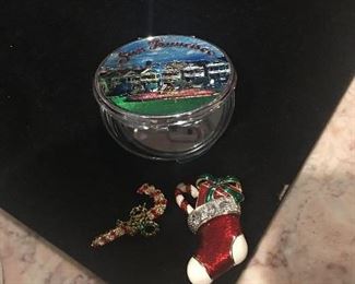 Item #567:  Set of two Christmas pins and one compact. $6