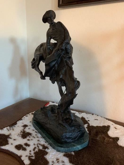 In the likeness of Frederic Remington "Outlaw."  approximately 23" H x 14" L  x 8" W. $1050.