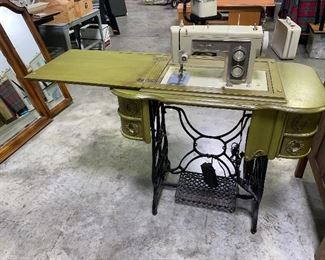 1960’s Kenmore sewing machine with antique cabinet 125.00