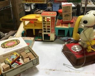 Vintage snoopy with Woodstock rotary telephone $75.        Fisher Price Garage $50, Fischer Price Airport$35