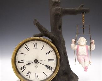 A late 19th century Ansonia No. 2 Swinging doll novelty clock.  30 hr movement with balance wheel escapement and paper dial w/Roman numerals marked "Patented, April 29, 1869.   Some wear, chip in the porcelain swing seat, lacks setting knob, winds, sets and running when cataloged.  8" high.  ESTIMATE $400-600