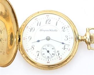 A Hampden Watch Company 14k Gold pocket watch. 12 size, 17 j, DR, SW, PS, in a 14k Gold fancy engraved Keystone case HC, SSD w/Roman numerals.  Serial # 2938337.   Minor wear, short hairline in dial, winds, sets and running when cataloged. ESTIMATE $1,000-1,500