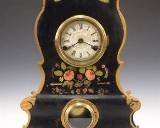 A late 29th century Terhune & Edwards iron front shelf clock.  30-hour time and strike movement, papered dial with Roman numerals.  Cast Iron case front with original Black painted finish, floral decoration and gilded detail.  Original finish with some touch-ups, damage to dial, running when cataloged.  15 3/4" high.  ESTIMATE $100-200