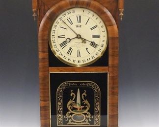A late 19th century Ansonia Brass & Copper Co. "Terry's Patent" calendar shelf clock.  8-day weight driven time and strike movement with painted metal dial, simple calendar and month indicator.  Rosewood case with a molded crown and turned drop finials over a single arched door with lower reverse painted tablet, on a molded base.  Nicely refinished with minor wear, dial restored, running when cataloged.  33" high.  ESTIMATE $400-600