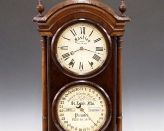 A late 19th century Southern Calendar Clock Co. "Fashion No. 2" model parlor clock.  8-day time and strike Seth Thomas movement with lower calendar mechanism, papered metal dials with Roman/Arabic numerals.  Walnut case with arched molded cornice above a single door with two round glasses flanked by turned columns on a molded base.  Old dark finish with wear, minor veneer damage, replaced finials, re-papered dials and rollers, running when cataloged.  31 1/4" high.  ESTIMATE $600-800