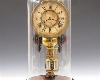 A late 19th century Ansonia "Crystal Palace" parlor clock, single post model.  8-day time and strike movement with papered dial and Roman numerals.  Walnut case with turned post and base under a glass dome.  Old finish with Ebonized detail some wear, brass tarnished, running when cataloged.  17 1/2" high overall.  ESTIMATE $300-400