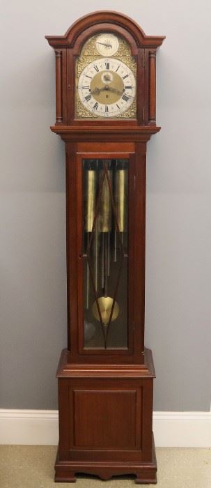 An early 20th century British mahogany hall clock.  8-day time and strike movement with quarter hour striking on nine tubular chimes in Westminster, Whittington or St. Michael tunes, brass dial with cast spandrels, silvered chapter ring and Roman numerals.  Mahogany case with arched crown over a conforming upper door flanked by turned columns above a long door with applied lattice and a base with raised panel and shaped bracket feet.  Old finish with minor wear, movement very dirty, not running when cataloged.  81" high.  ESTIMATE $800-1,200
