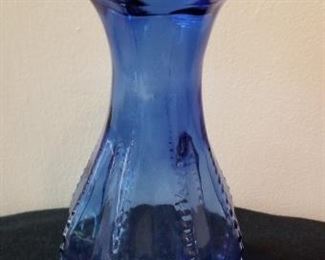 #88 blue glass vase 7 inches tall $5
