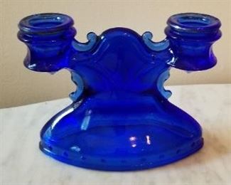 #75 blue glass candle holder 7 inches wide 5 inches tall $7