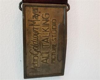 #67 Antique leather belt Metro Goldwyn Mayer all talking picture studio personal bodyguard is the inscription on the brass buckle. 41 inches long. $75