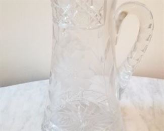 #60 cut glass pitcher 12 tall 6 inch diameter at base $10