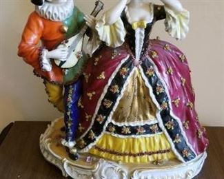# 28 Dresden style volkstedt porcelain dancer with jester 12 tall x 10 wide. $175