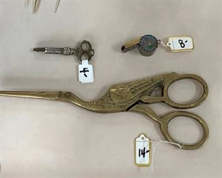 Key  $4.   Cloisonné mini whistle $8.  and Stork scissors $14.