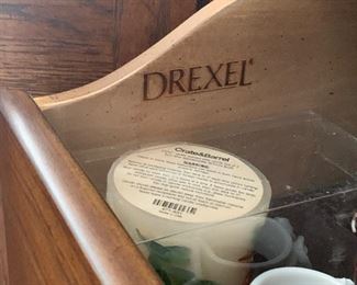 Drexel dining room table and lighted cabinet 