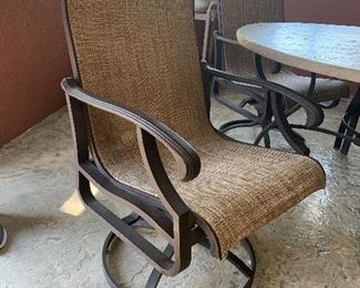 Like new - faux stone heavy aluminum patio table and 4 chairs