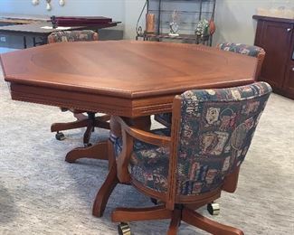Flip top game table w/6 swivel chairs $1140.