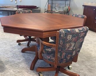 Flip top game table w/6 swivel chairs  $1140.