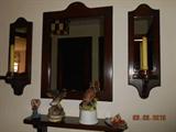 Wall grouping -- mirror, shelf, candles.