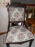 Upholstered floral carved chair.