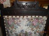 Upholstered floral carved chair.