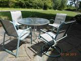 Glass patio table w 2 swivel / 2 chairs