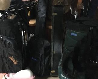 Golf clubs, guitars and bongo drums. 