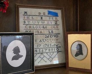 Silhouettes and an old needlepoint sampler   