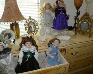 Contemporary dolls.  Antique mirrors