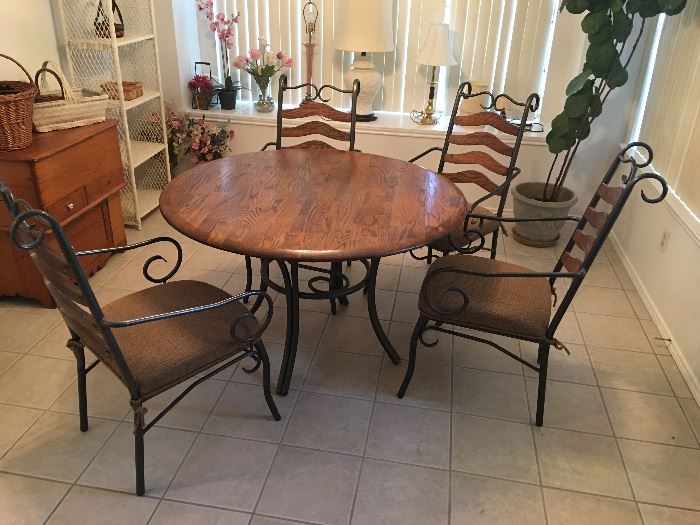Wrought Iron, and Wood Table; top and iron and brown upholstery seats are all in excellent condition.