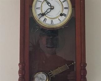 Commemorative wind up wall clock.