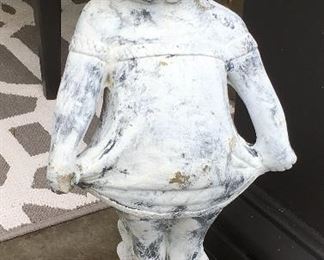 Concrete Statue of little girl pulling dress.