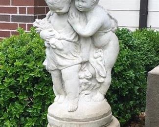 Concrete Statues with umbrella on base fountain.