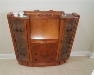 Available for presale, priced @ $495   Call for purchase. Nice Desk in middle, dimensions 44x46x13 . Nice shallow pc, leaded glass is nice touch to restoration. 