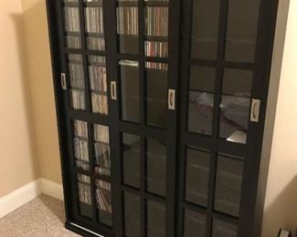 Media Case (1 of 2) - 47"W x 9"D x 62"H - 3 Sliding Doors, Dark Stained Oak (Contents Not Included) $187  (orig. $250)