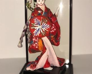 Lot #27, Asian doll with plastic display, $14
