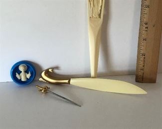 Lot #134 three plastic items and a metal sword, $10/all