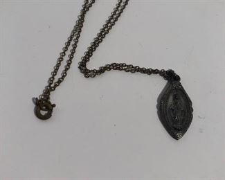 Lot #306 old medal on chain, $10