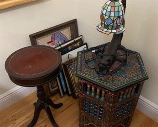The table on the right and the cat lamp are sold.