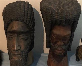 2 heavy wood carved heads
