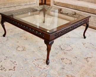 Custom traditional cocktail table, Fretwork design on sides, glass top, pad feet, 45” square Asking $1200