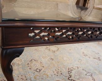 Custom traditional cocktail table, Fretwork design on sides, glass top, pad feet, 45” square Asking $1200