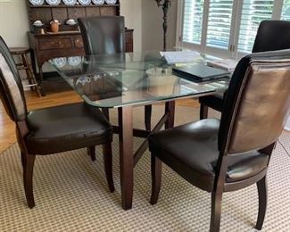 GLASS TOP OVER STONE BASE TABLE AND 4 LEATHER CHAIRS $400 SET