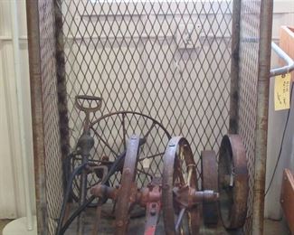 Cage type rolling cart (note there are two of them)  Great to hang items/tools from the wire sides.  there is a slot for a shelf.  There is  a small anvil and a lot of rustic yard art