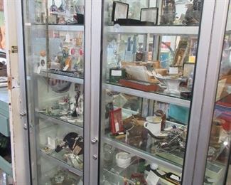 Many perfume bottles and costume jewelry.  Note all display cases and shelves are also for sale
